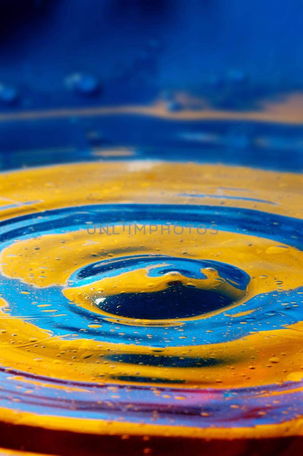 Close-up view on blue and yellow aquarelle paint like Ukrainian flag by Novic