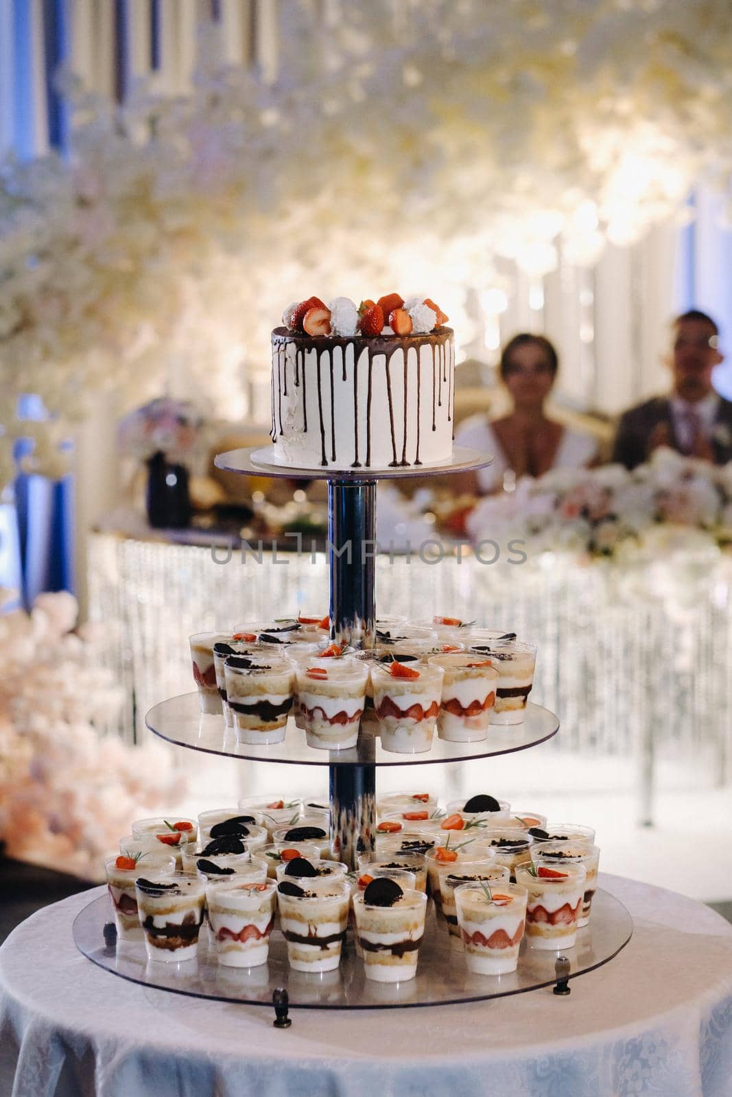 Cake and cakes on a stand at a wedding.