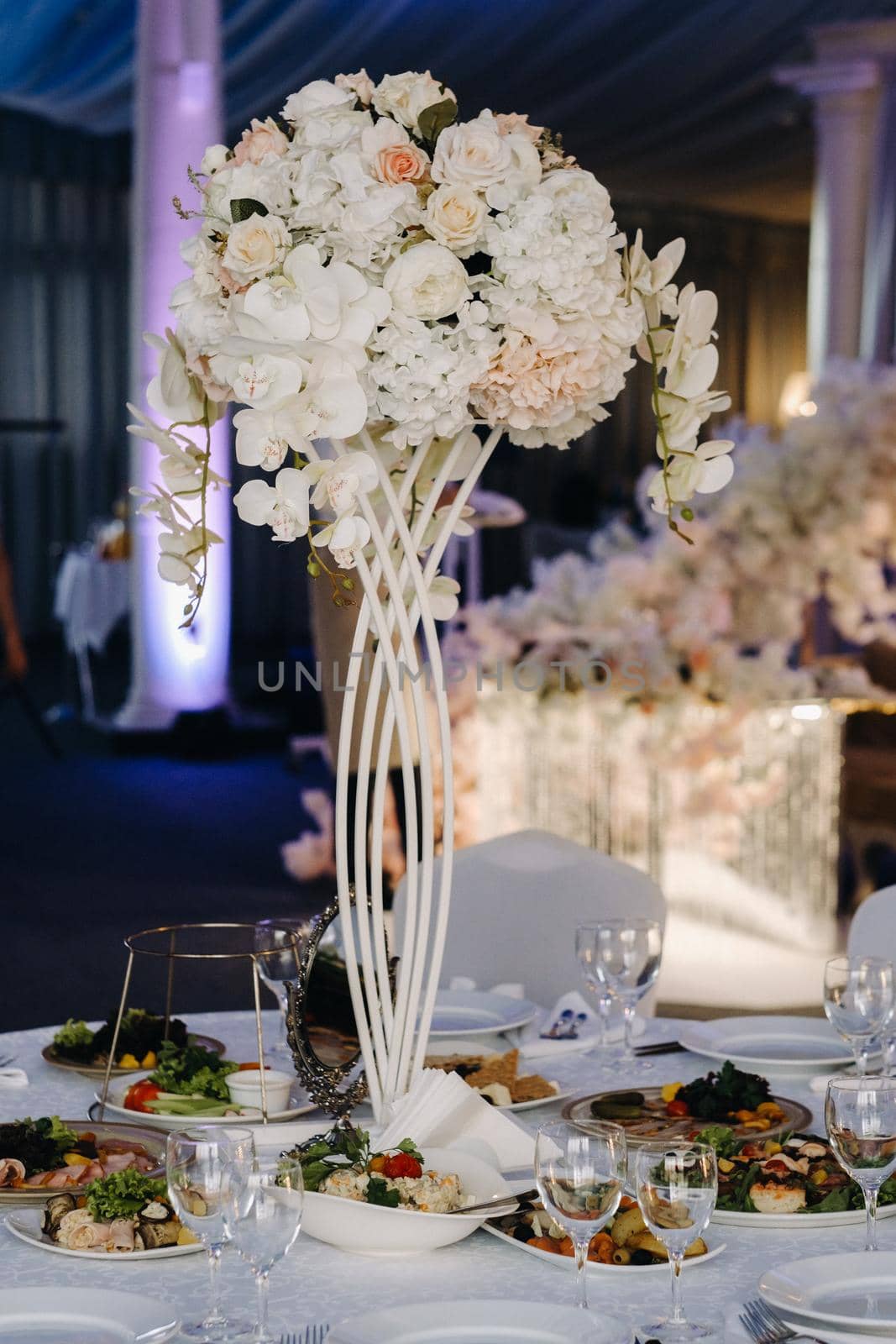 Decorated Table for a wedding reception in a restaurant .Wedding decor.