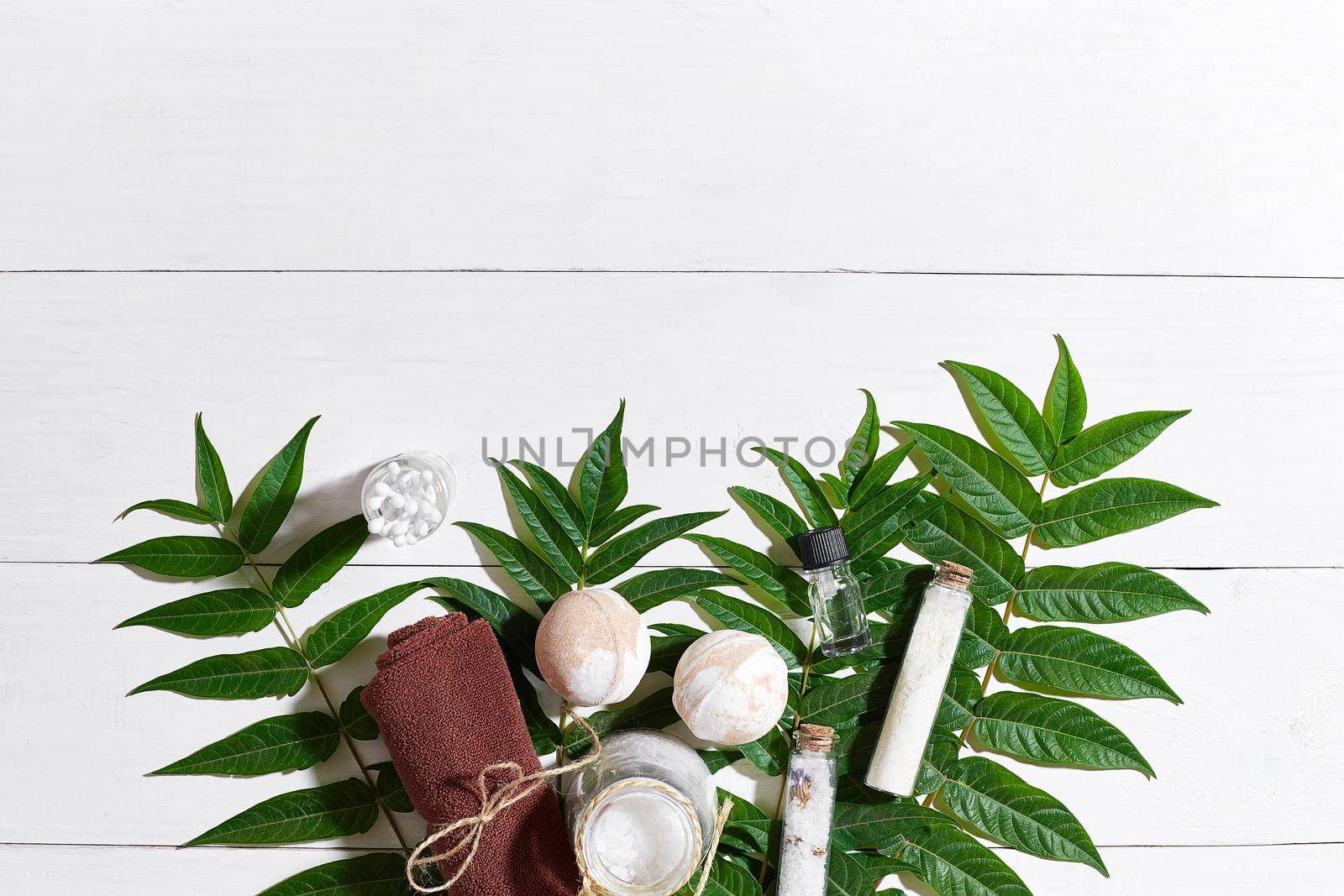 Natural spa and aromatherapy skincare beauty products with bathroom accessories including exfoliating scrubs, oils, sponges, bath bombs and soaps. Top view. Copy space. Still life. flat lay