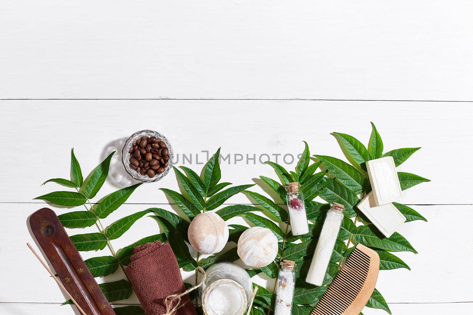 Natural spa and aromatherapy skincare beauty products with bathroom accessories including exfoliating scrubs, oils, sponges, bath bombs and soaps. Top view. Copy space. Still life. flat lay