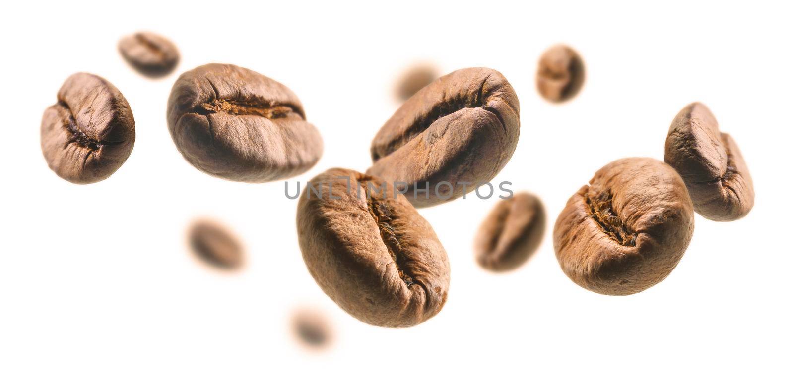 Coffee beans levitate on a white background.