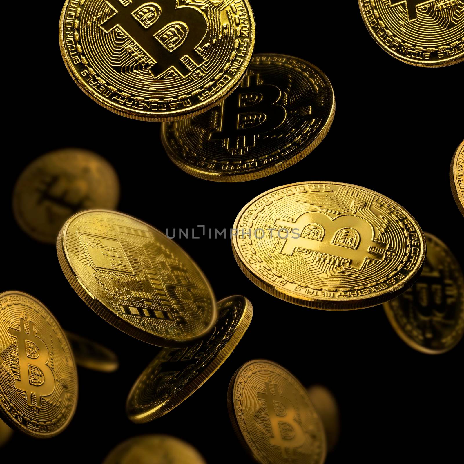 Gold coin Bitcoin levitates on a black background.