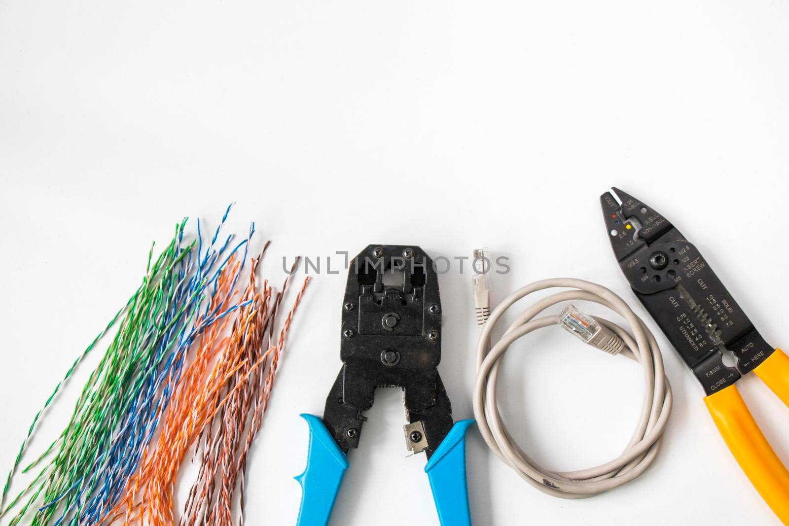 Internet cable and tools on the white background by Taidundua