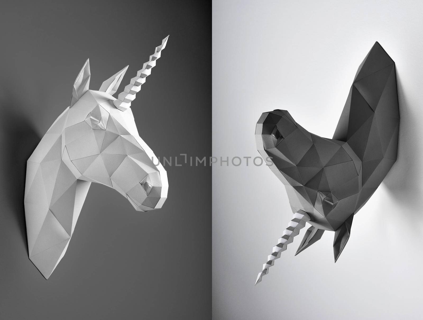 Contrast weird wto parts collage of black and white unicorn heads. Horses have similiar geometrical lines and shape with angles. Unicorns hang on white and black background.