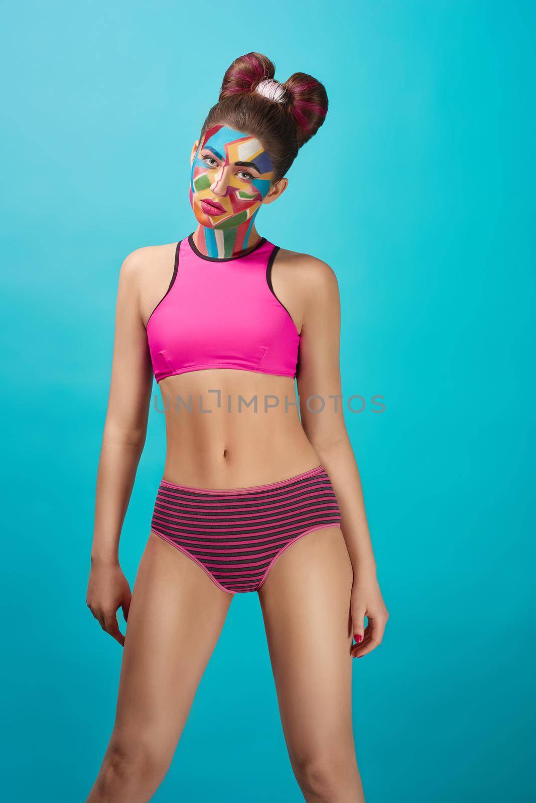 Slender model in sportive pink top posing. by SerhiiBobyk