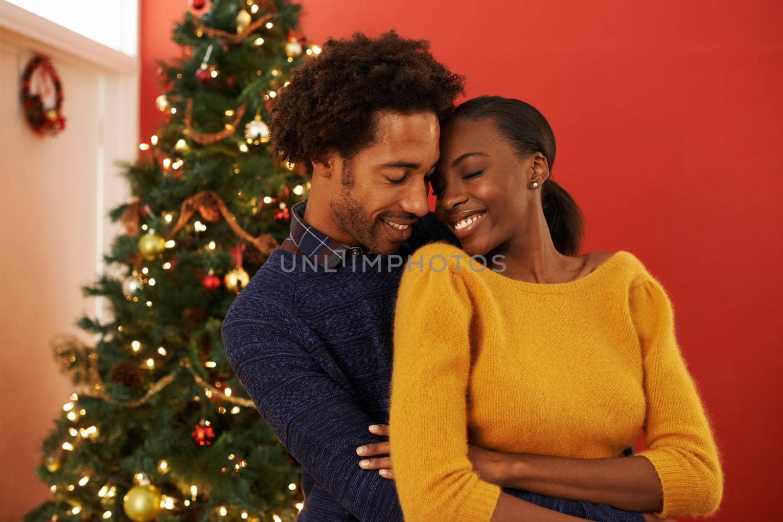 Shot of a loving young couple on Christmas.