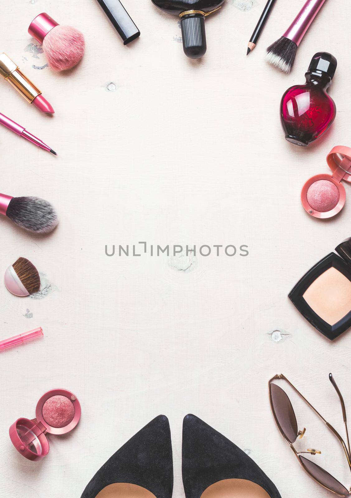 Feminine cosmetic background. Overhead of essentials of a modern woman. Cosmetic objects frame. Instagram filter style