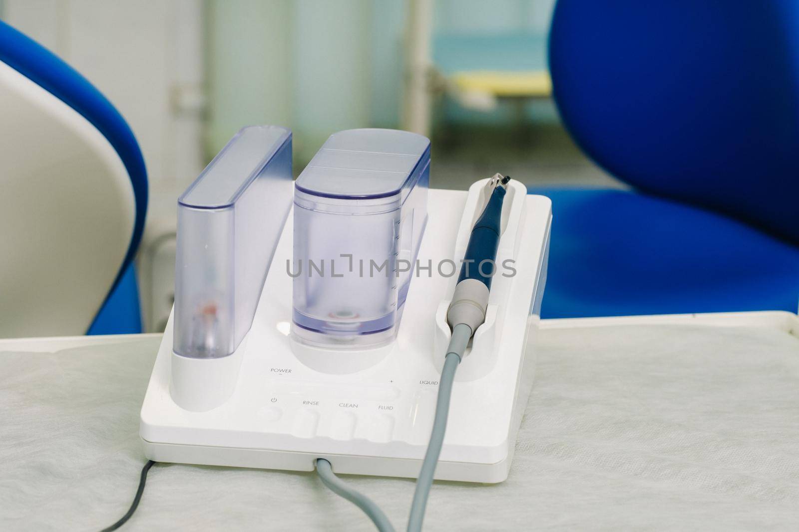 Ultrasonic scaler in the dental office. Dentistry Concept by Lobachad