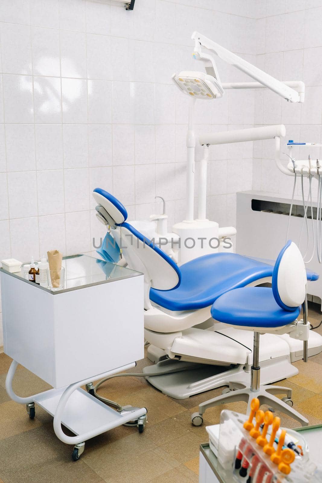 An empty chair in the dentist's office. Empty dentist's office.