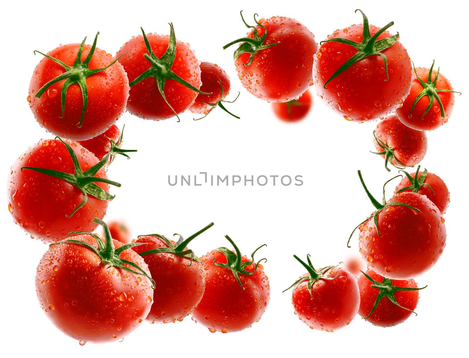 Red tomatoes levitate on a white background.