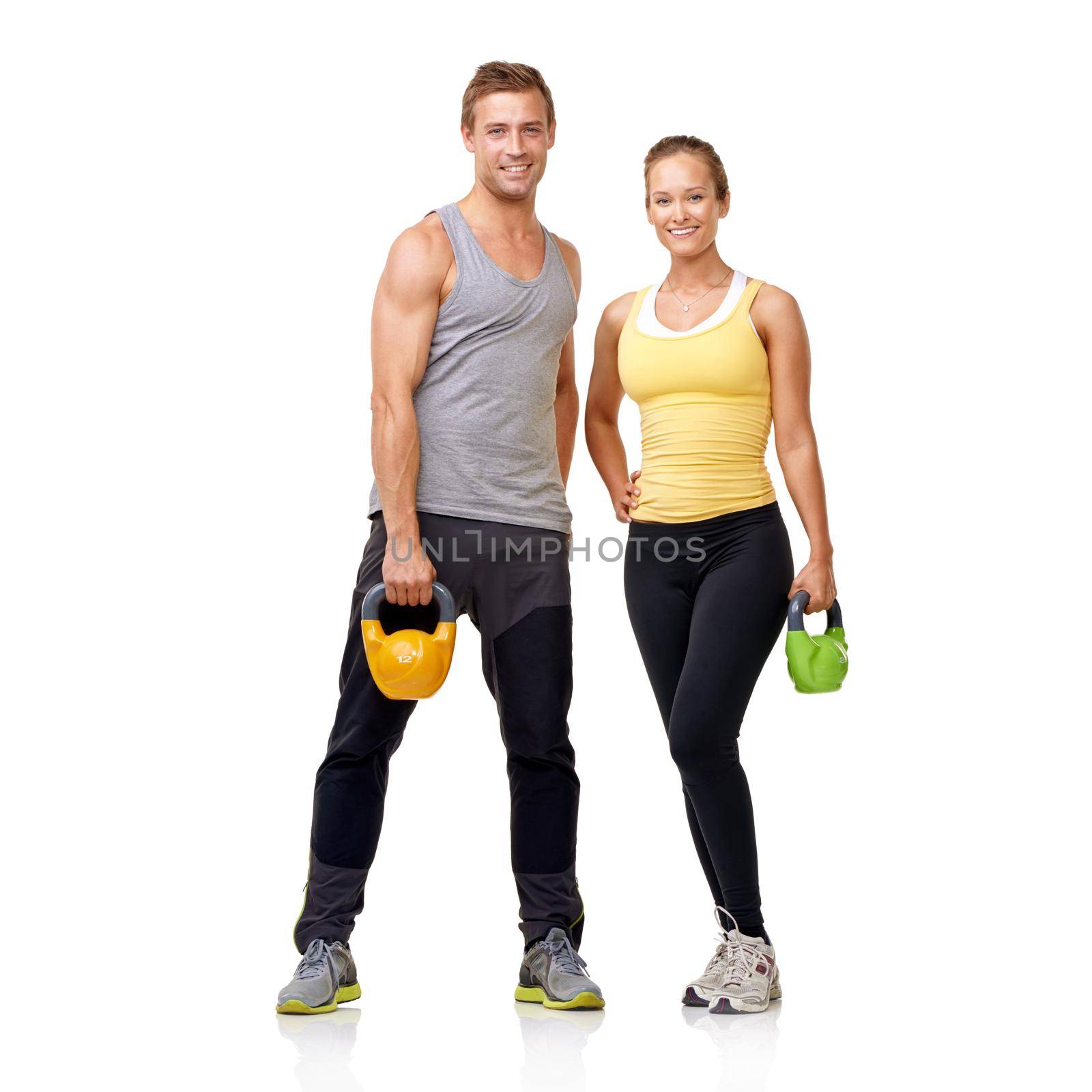 Get your workout on. Studio shot of of two people with weights isolated on white. by YuriArcurs