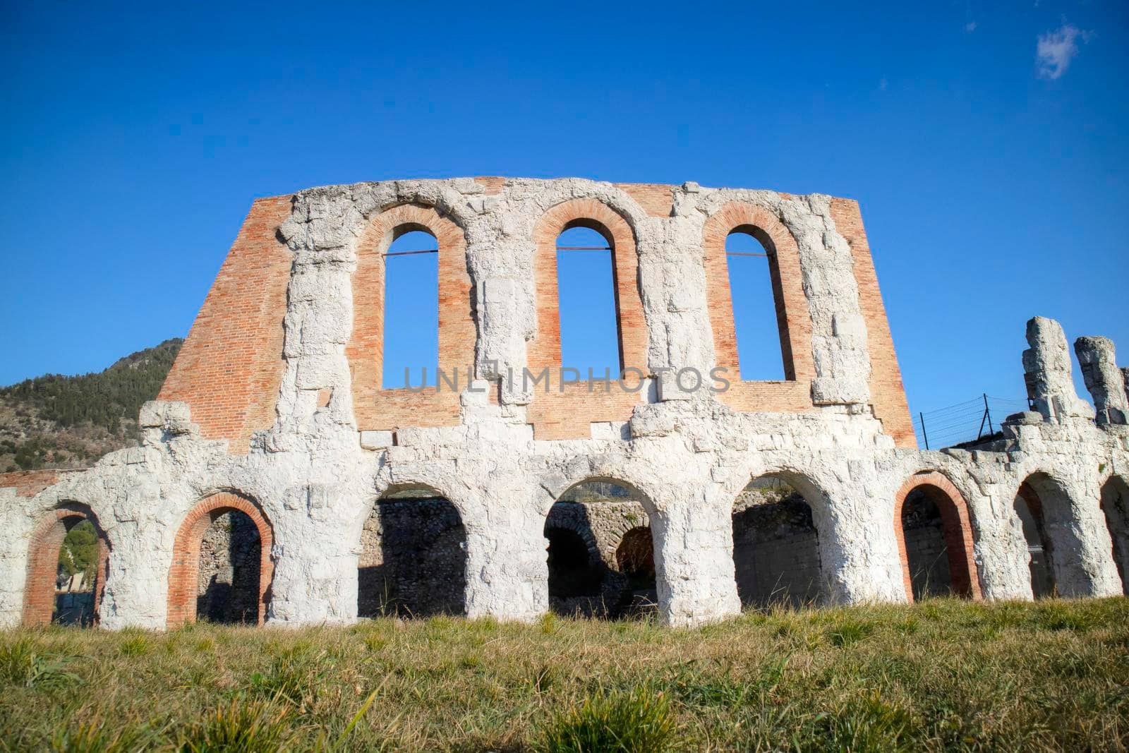 The remains of the Roman amphitheater in Gubbio Italy  by fotografiche.eu