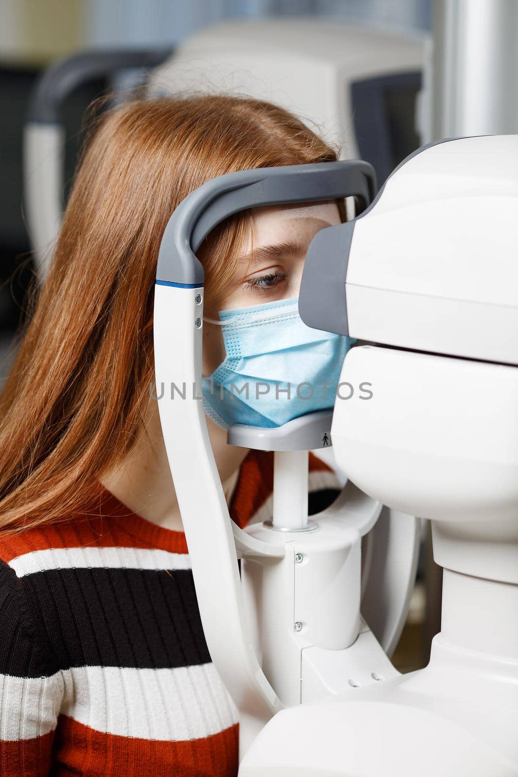 Female closing the eye for the ophthalmologic check