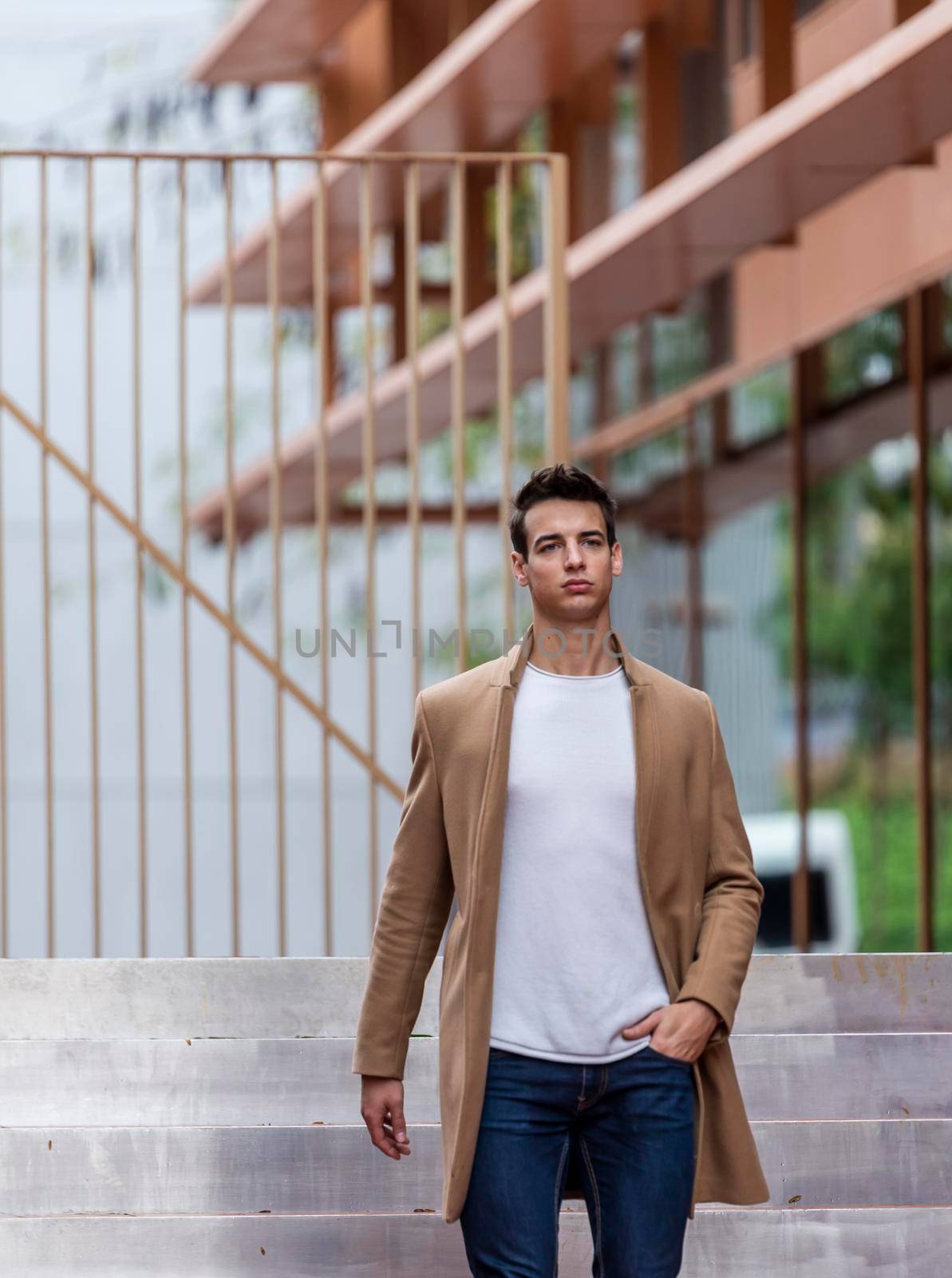 Handsome young man outdoor in winter fashion, wearing woolen jacket in city setting by raferto1973