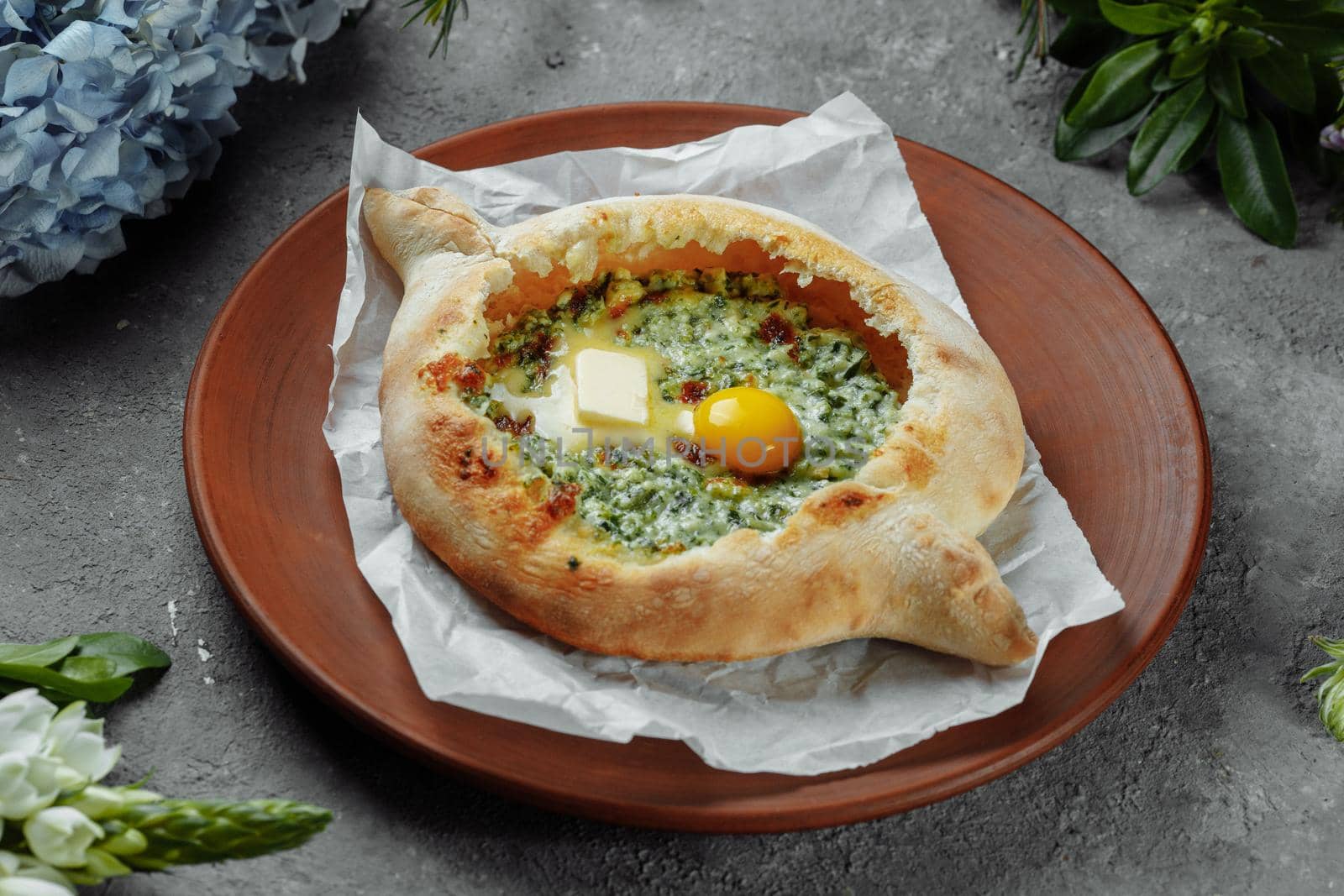 Some khachapuri traditional Georgian homemade cheese and spinach pies on the plate by UcheaD