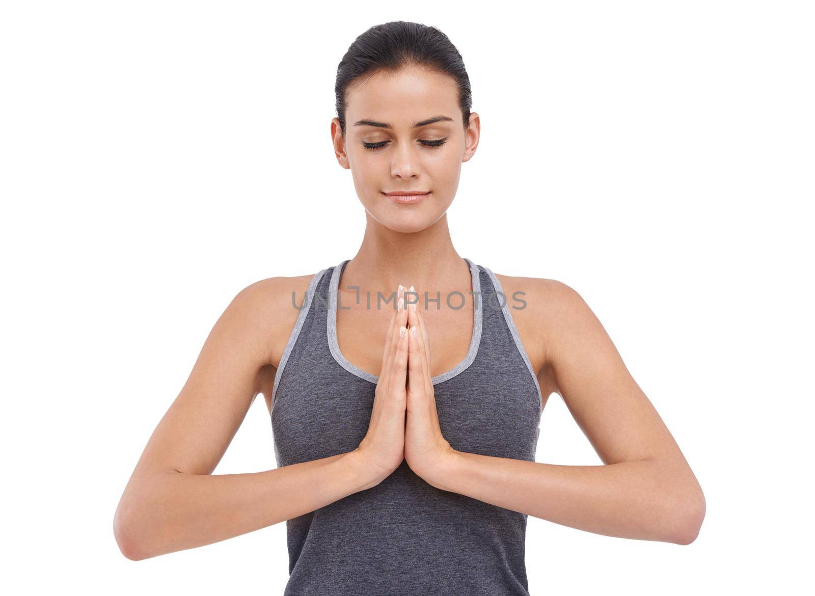 A young woman meditating isolated on white.