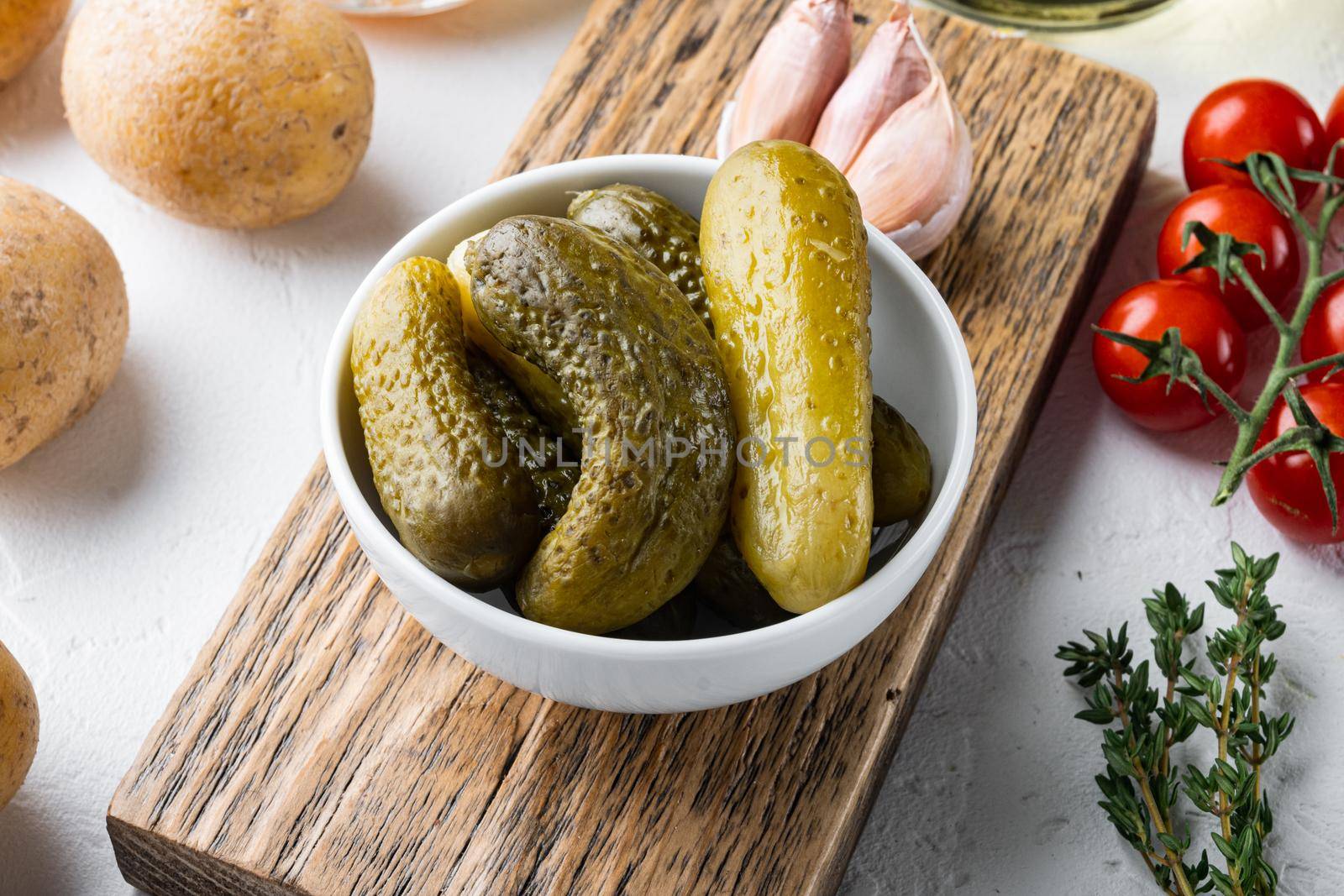 Marinated cucumbers gherkins set, on white background