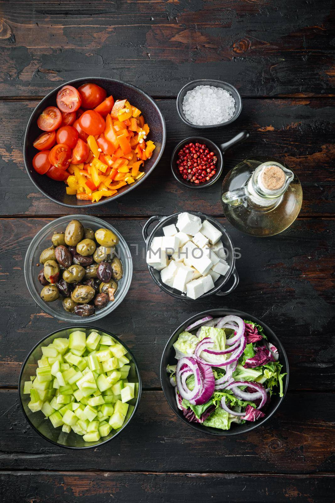 Ingredients, for greek salad, on old dark wooden table background, top view flat lay