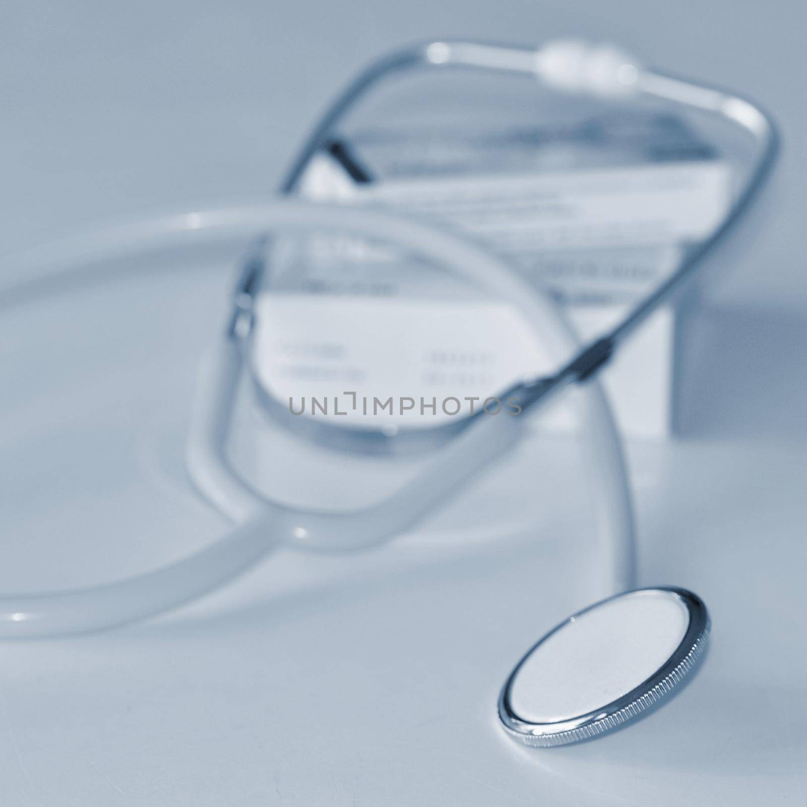 Stethoscope with medication on the table. Concept for health and medicine. Hospital background.