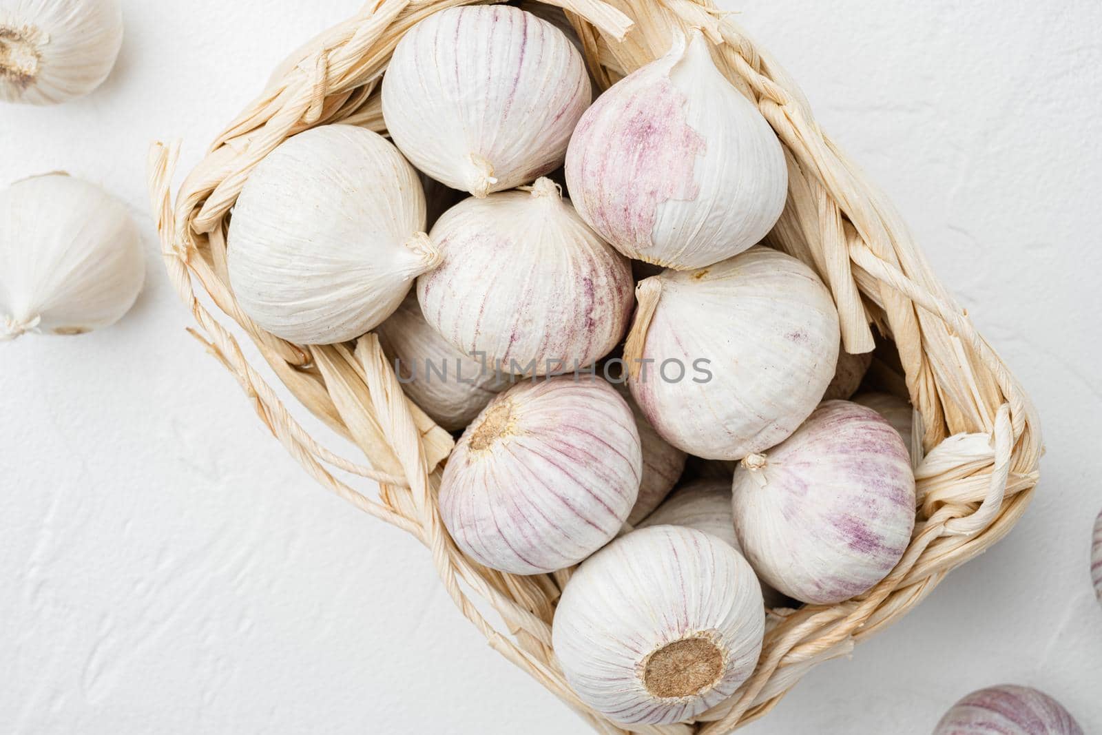 Baby garlic set, on white stone table background, top view flat lay