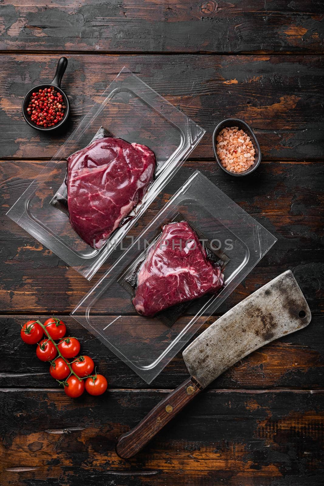 Beef rump steak pack, on old dark wooden table background, top view flat lay by Ilianesolenyi