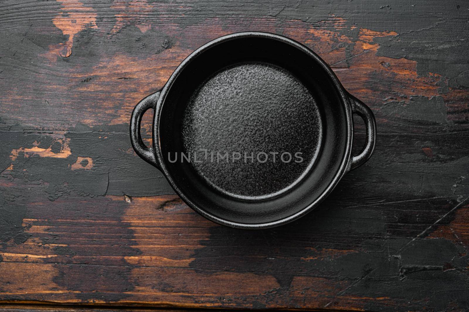 Empty cooking pot with copy space for text or food with copy space for text or food, top view flat lay , on old dark wooden table background by Ilianesolenyi