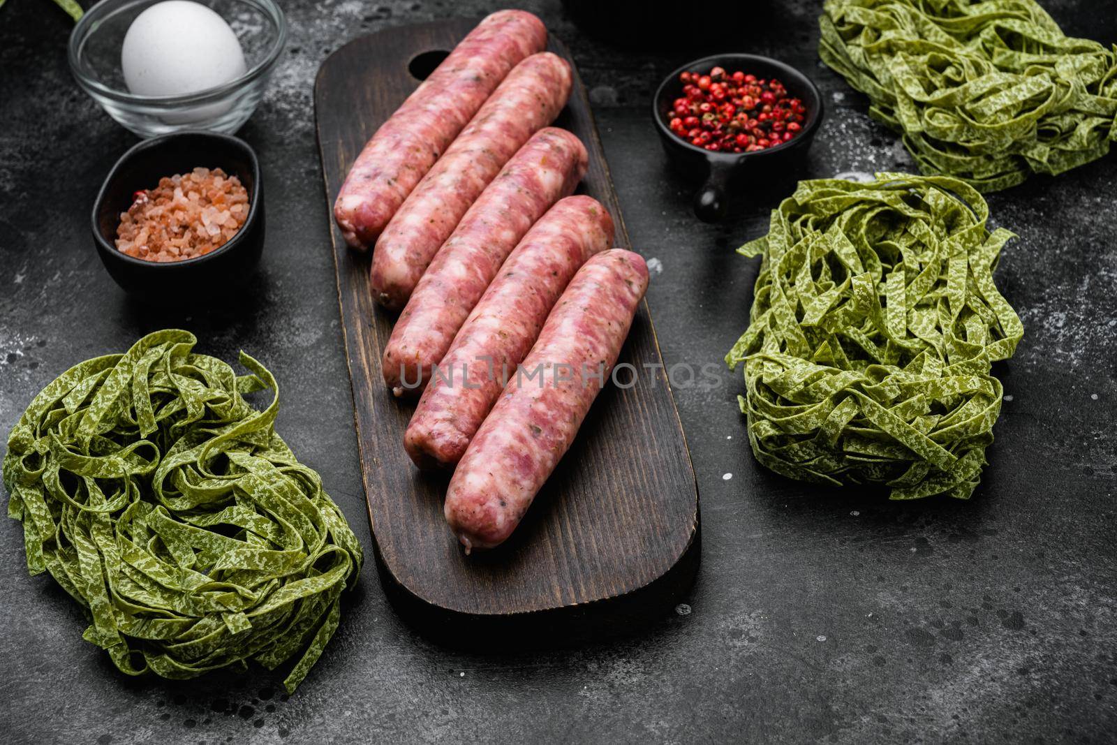 Italian cuisine food ingredients, on black dark stone table background by Ilianesolenyi