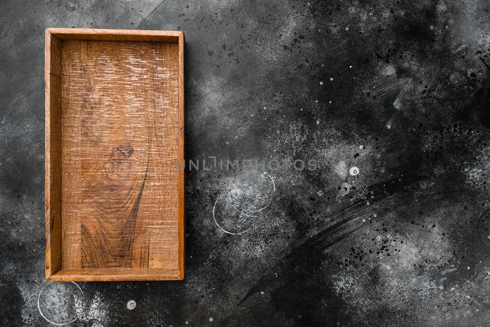 Empty dark wooden box set with copy space for text or food, top view flat lay, on black dark stone table background