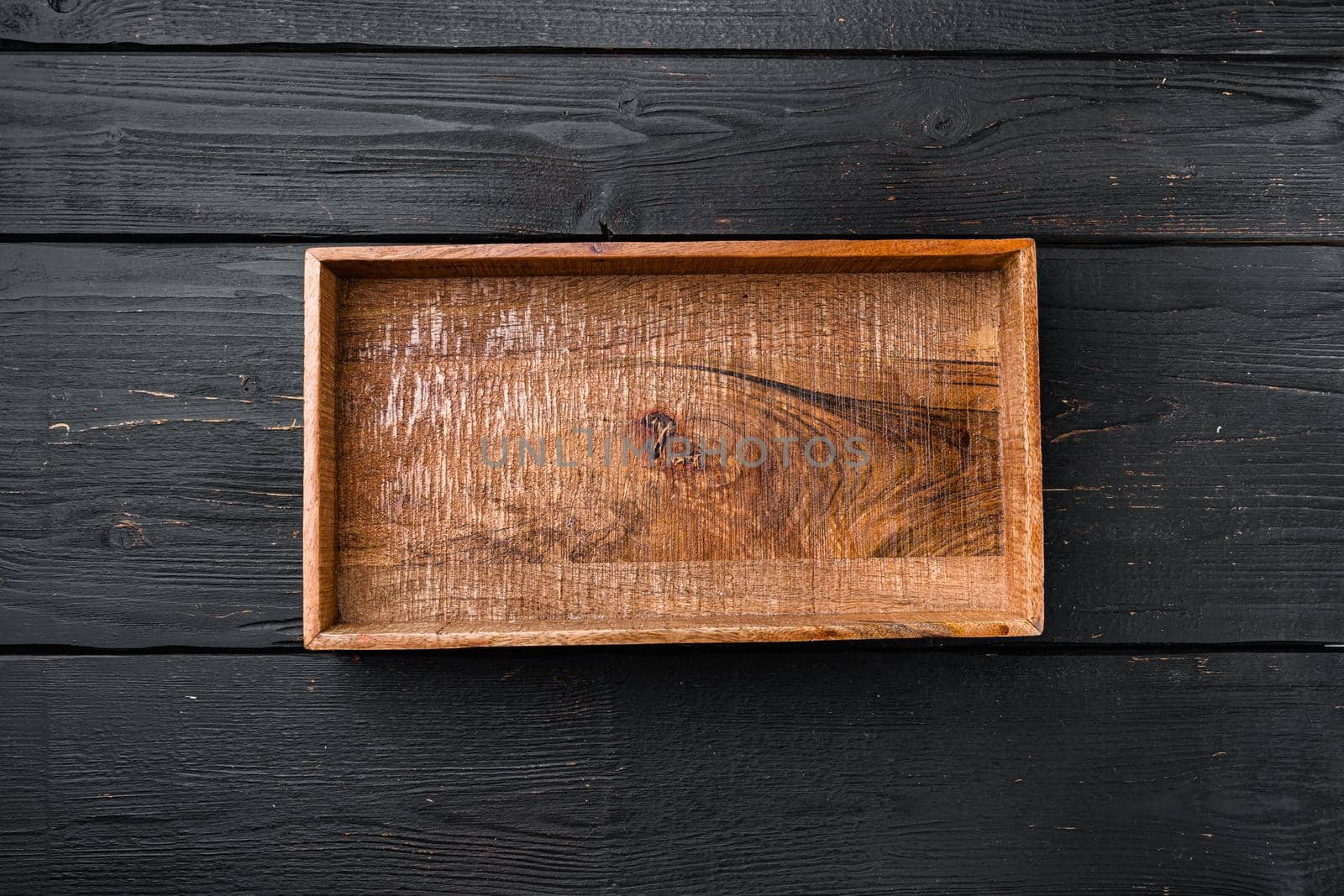 Rustic wooden box or container set with copy space for text or food, top view flat lay, on black wooden table background