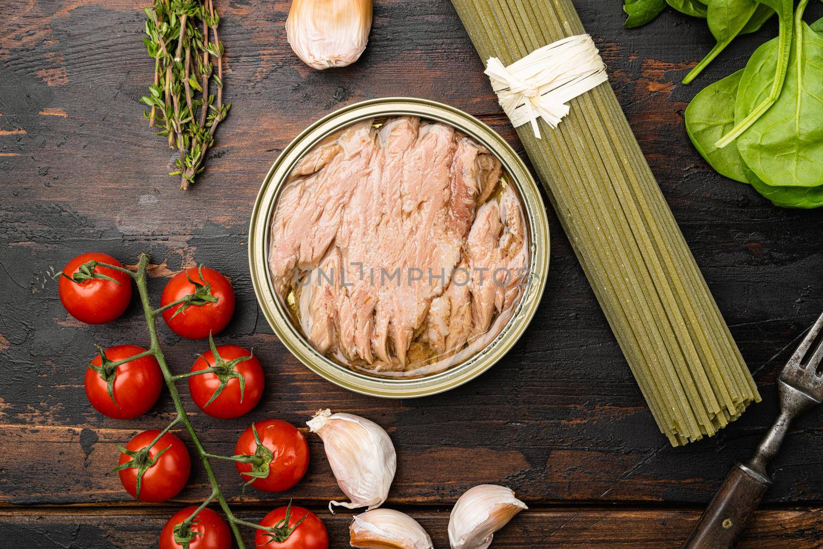 Pasta with tuna raw ingredients set, on old dark wooden table background, top view flat lay