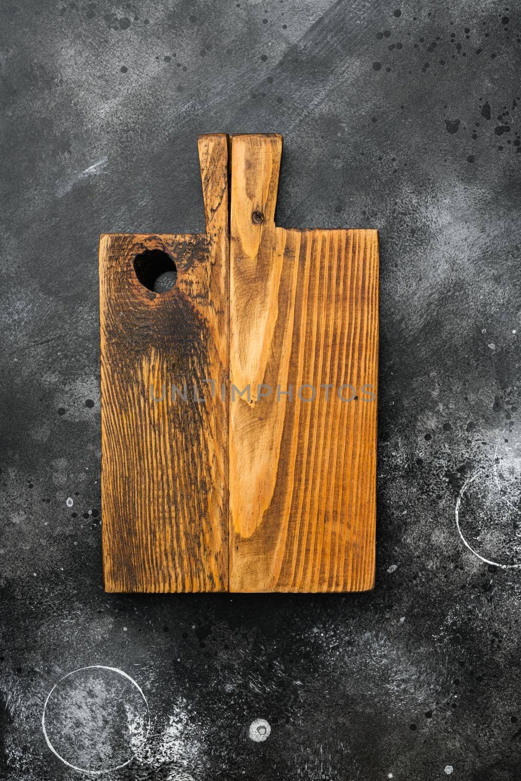 Rustic cutting board set, top view flat lay , with copy space for text or food, on black dark stone table background