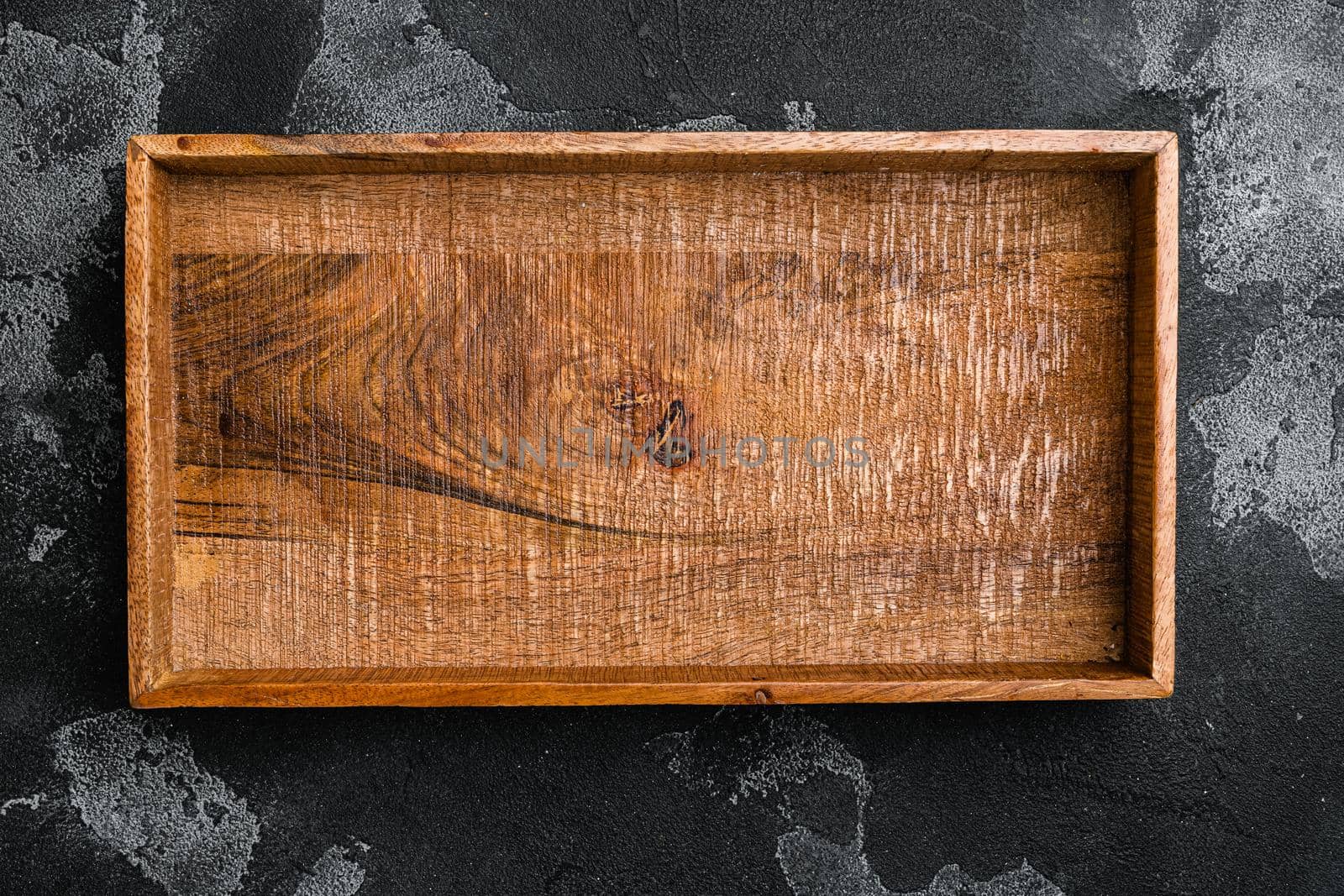 Empty dark wooden box with copy space for text or food, top view flat lay , on black dark stone table background by Ilianesolenyi