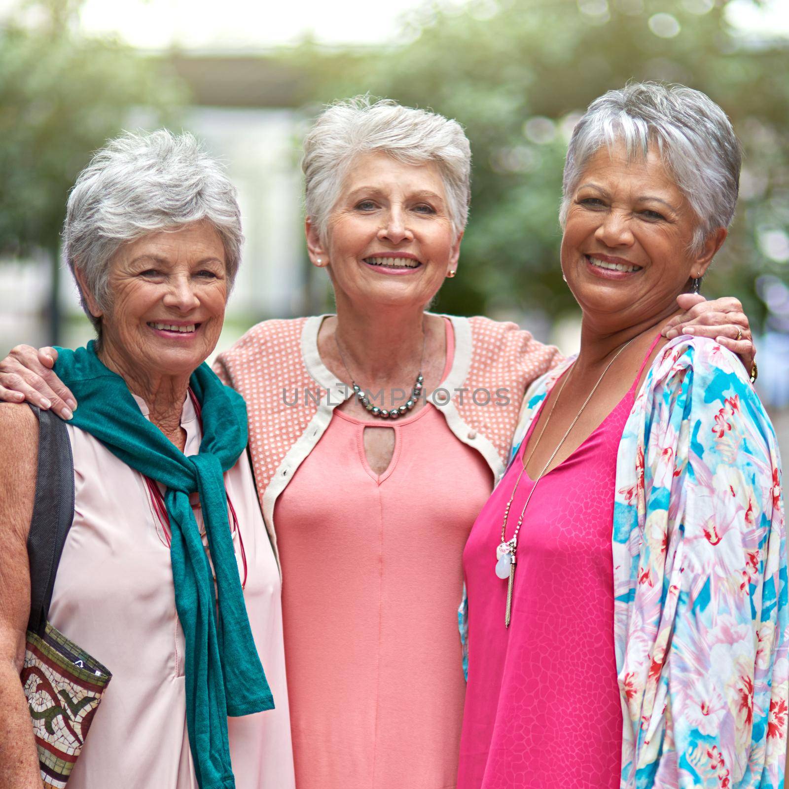 This mall has it all. Cropped portrait of a three senior women out on a shopping spree. by YuriArcurs