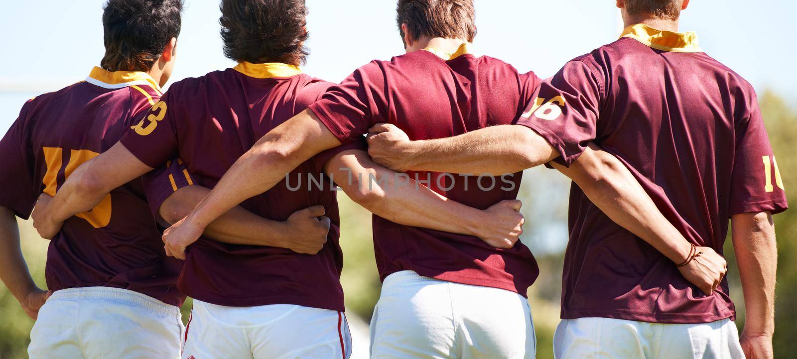 We came to win. Rearview shot of a young rugby team lining up for a scrum. by YuriArcurs
