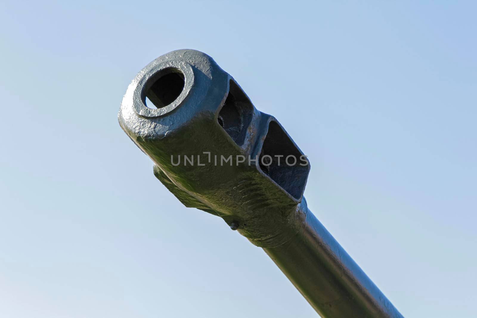 Muzzle of a cannon from World War II in a museum. Close-up.