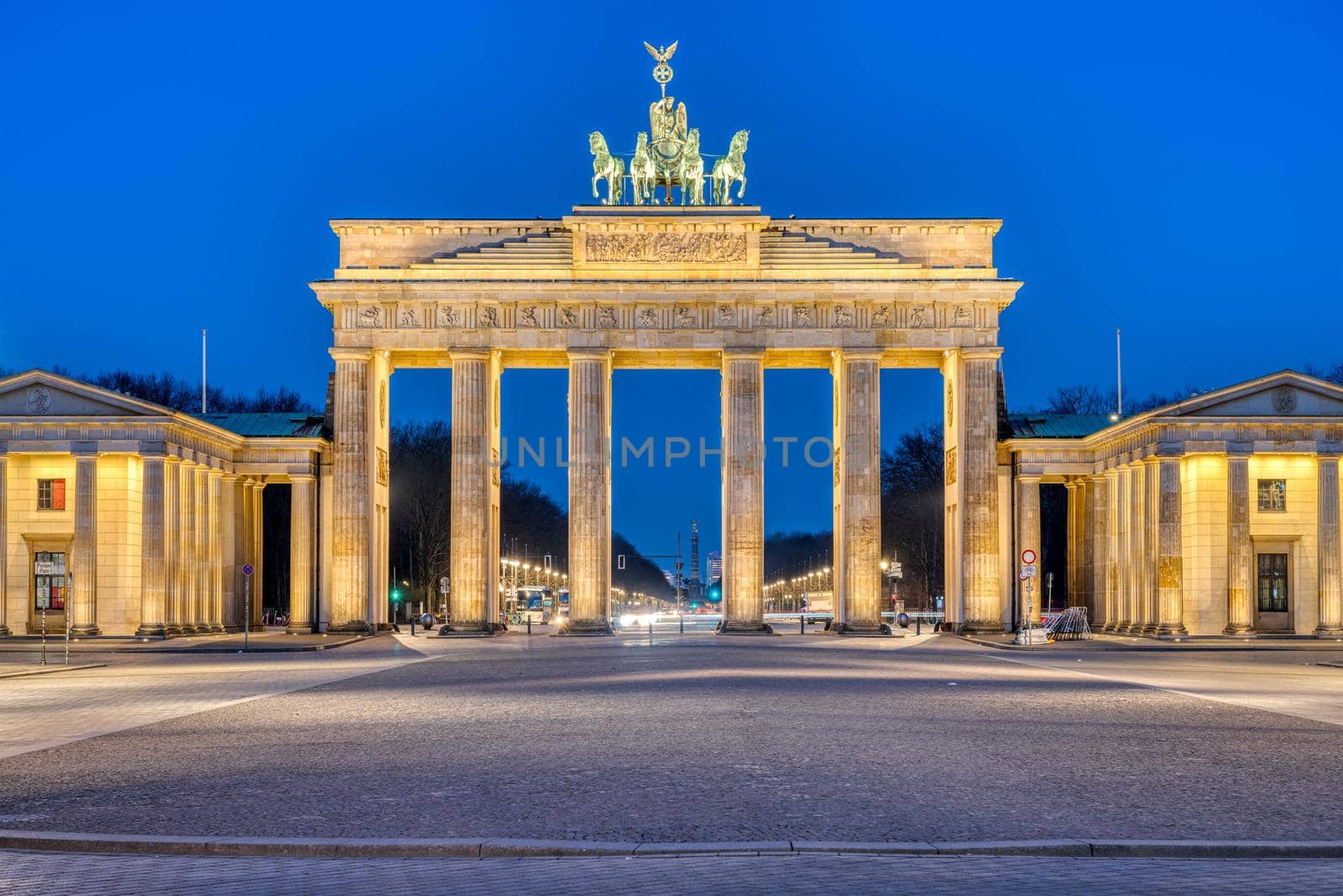 The famous illuminated Brandenburg Gate at dawn by elxeneize