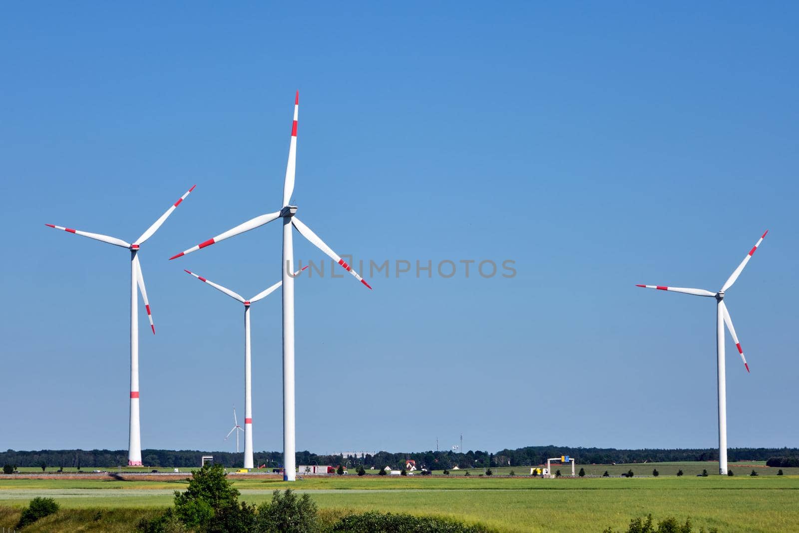 Modern wind turbines in a rural landscape seen in Germany