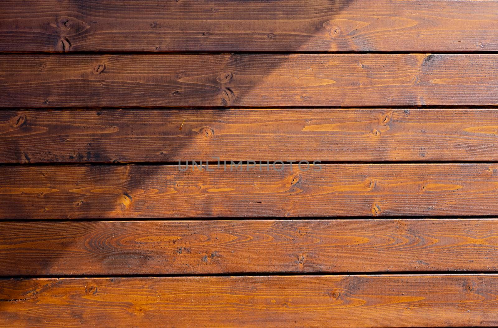 Brown colored fir wood planks wall  by fotografiche.eu