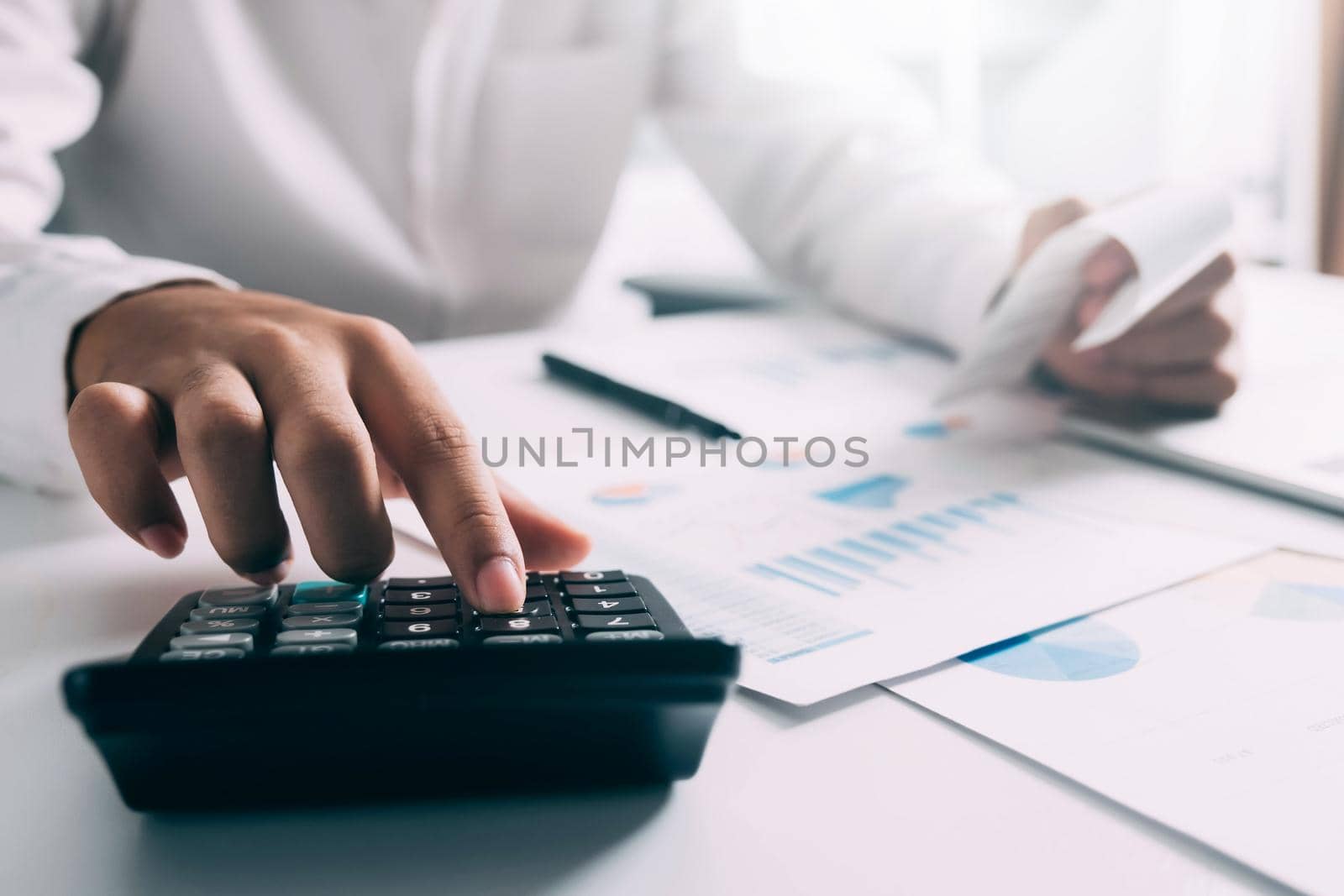 Businessman working on Desk office business financial accounting calculate by ijeab