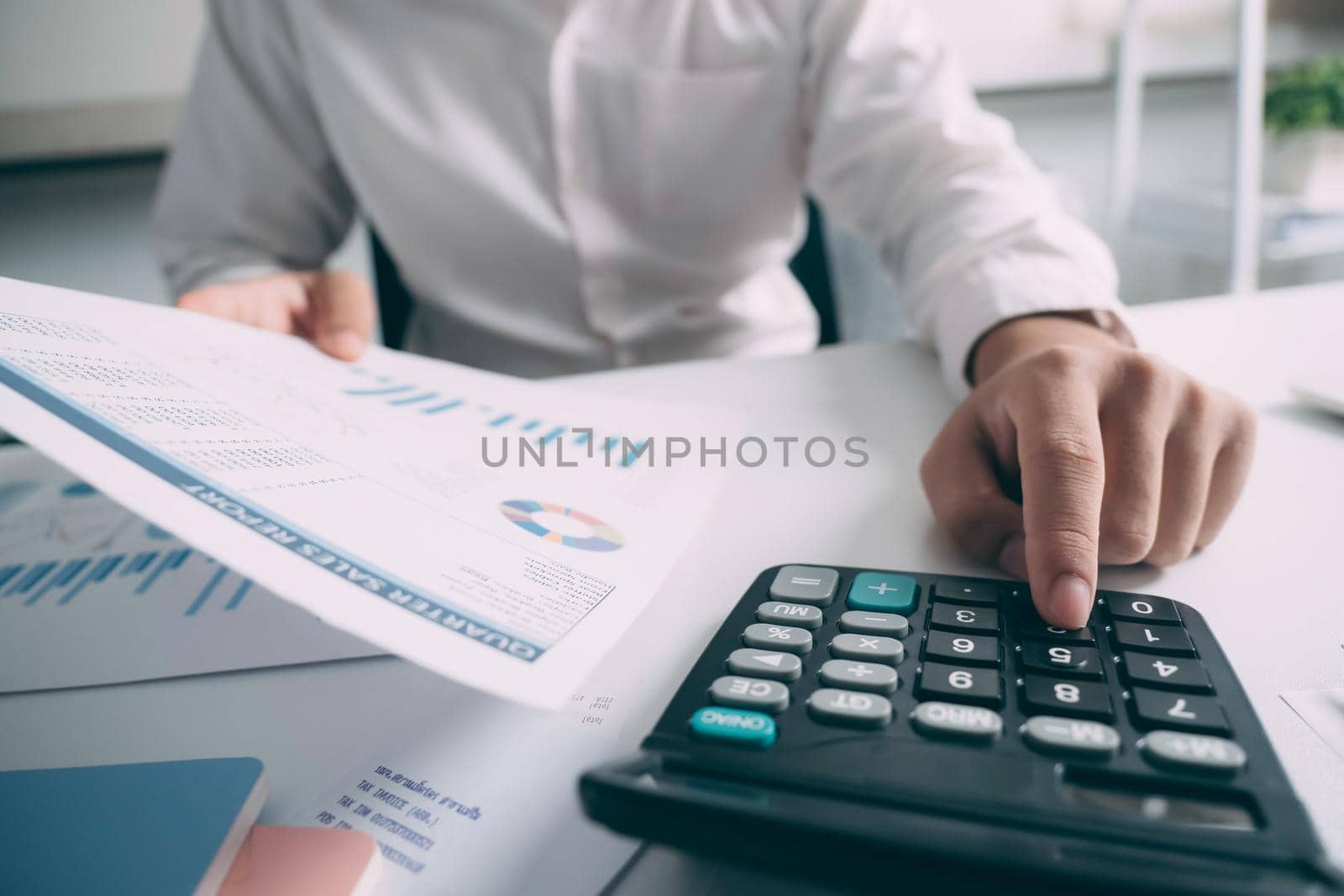 Businessman working on Desk office business financial accounting calculate by ijeab