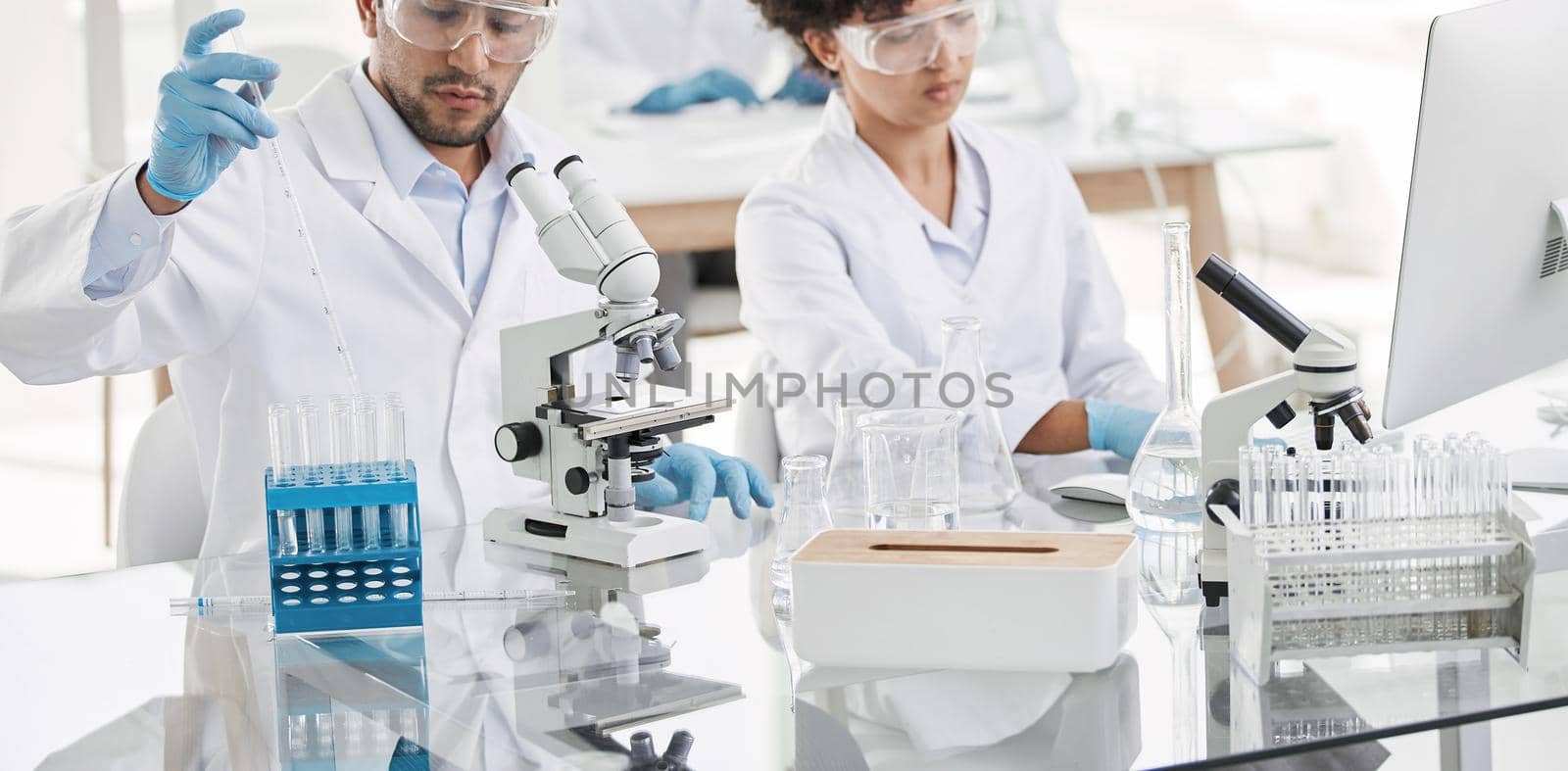 young scientists conduct research in the laboratory. close-up.