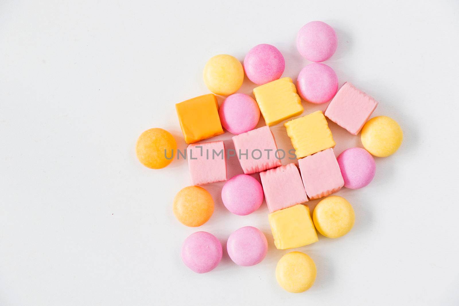Sweet colorful confectionery, candy on the white background, high angle view