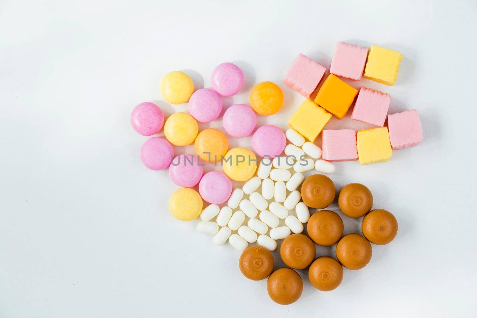 Sweet colorful confectionery, candy on the white background by Taidundua