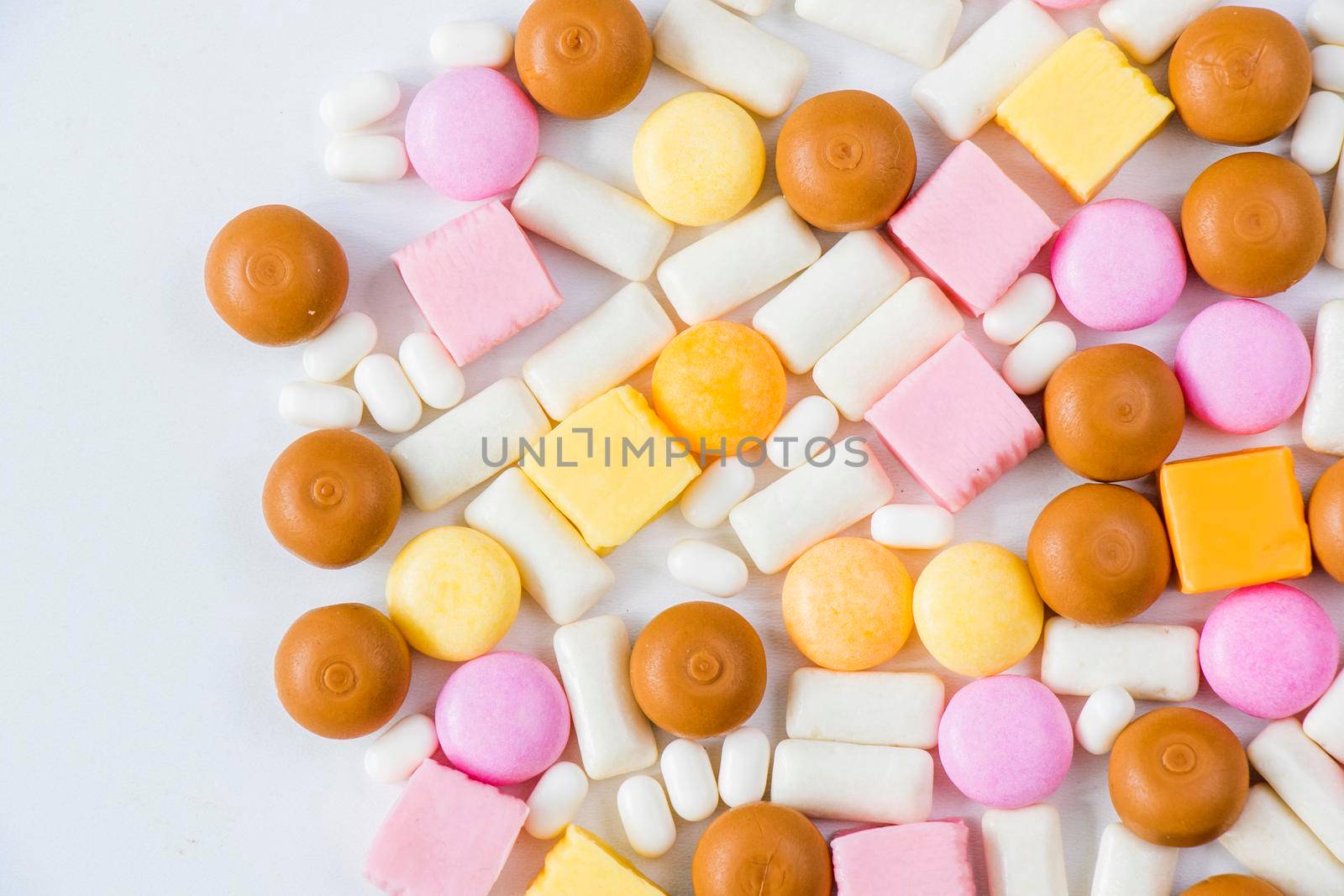 Sweet colorful confectionery, candy on the white background by Taidundua