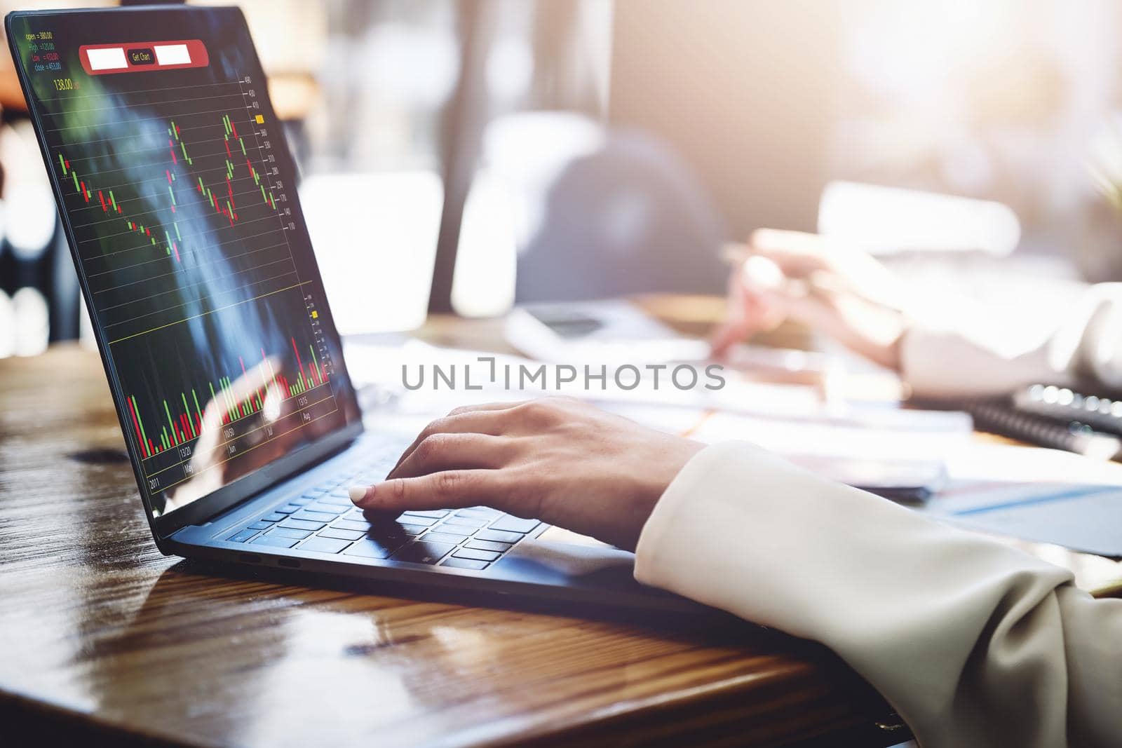 Financial and investment planning concept, female businesswoman using computer to analyze charts to find entry points on a trading board. through digital media via the internet