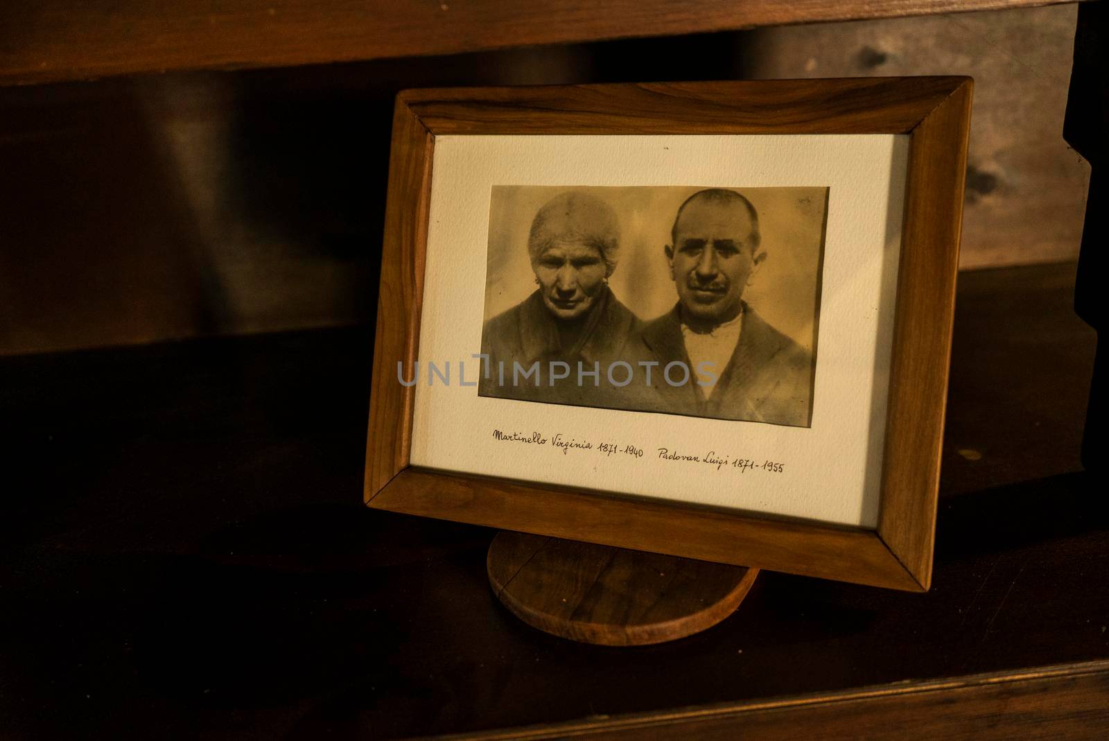 FRATTA POLESINE, ITALY 14 MARCH 2022: Detail of Photos of family memories of the last century on a shelf