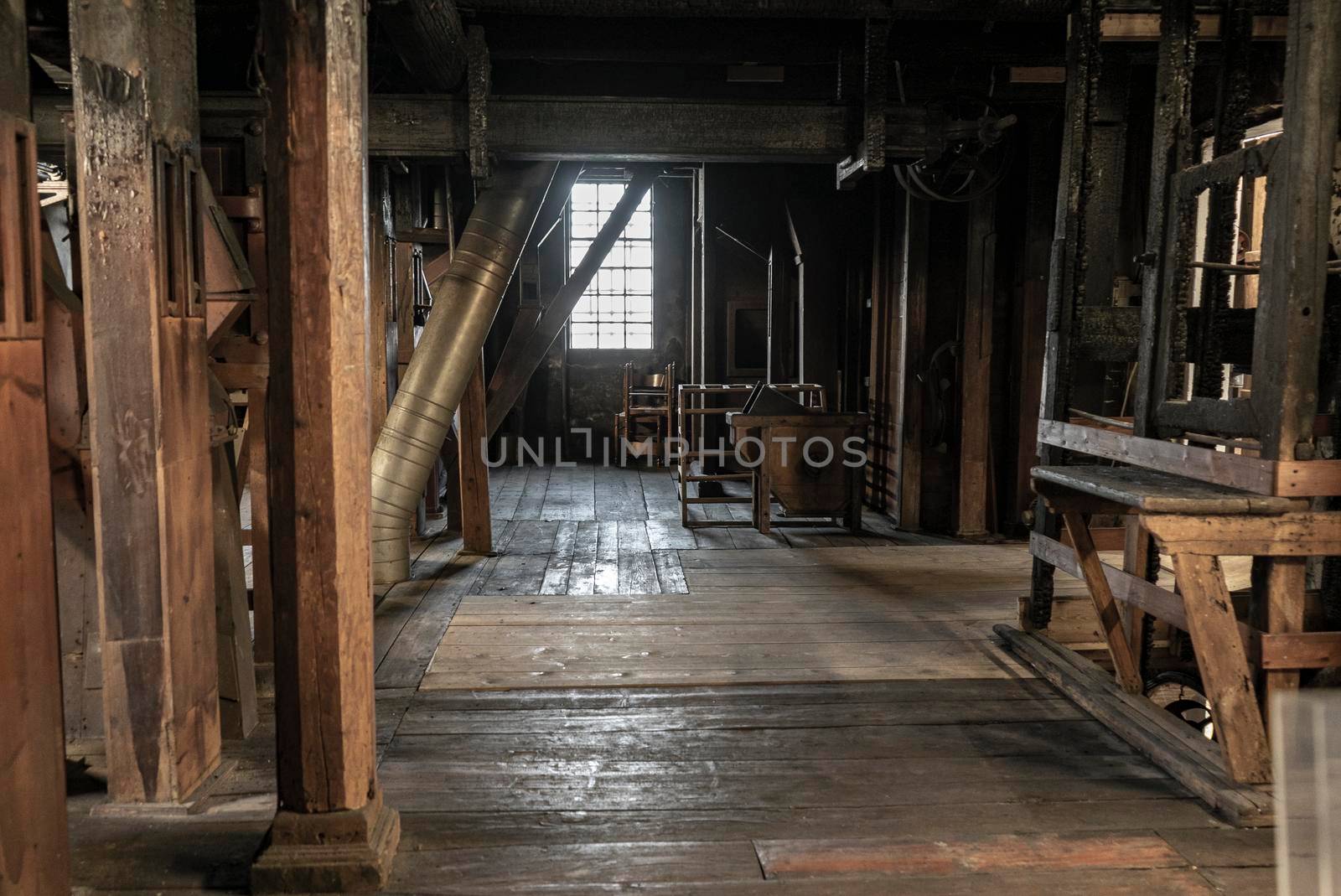 Interior shot of an old historic factory with machinery