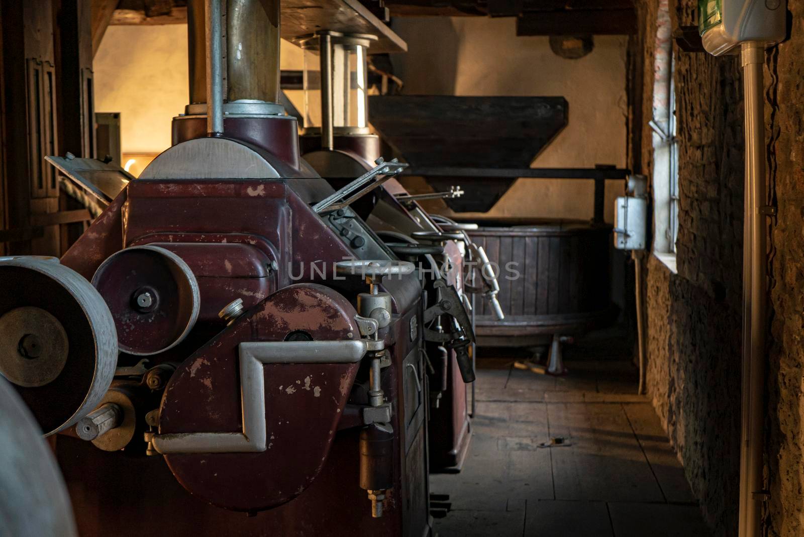 Interior of an old historic factory with machinery by pippocarlot