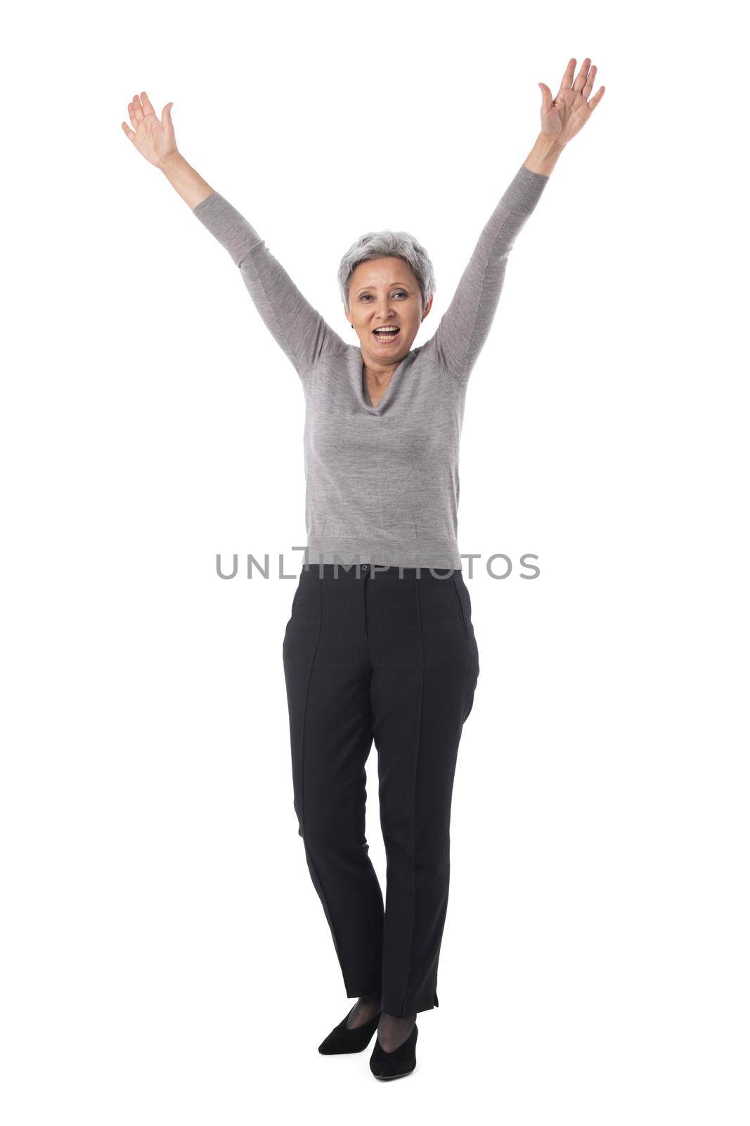 Mature asian business woman winner with raised arms isolated on white background full length studio portrait